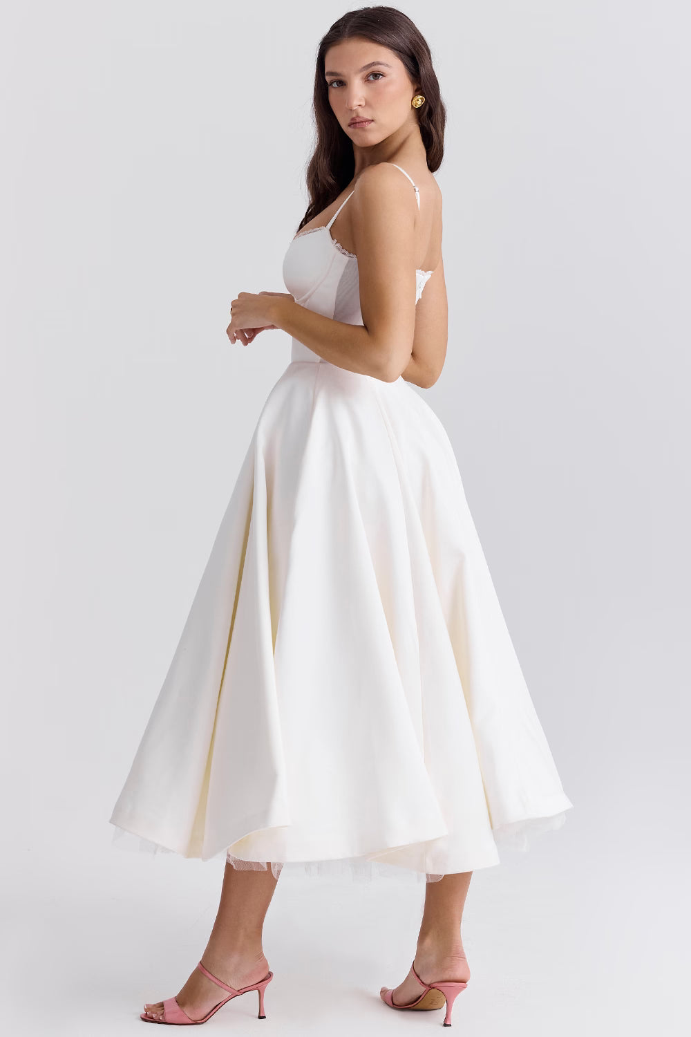 Side view of white midi dress with open back and flared skirt