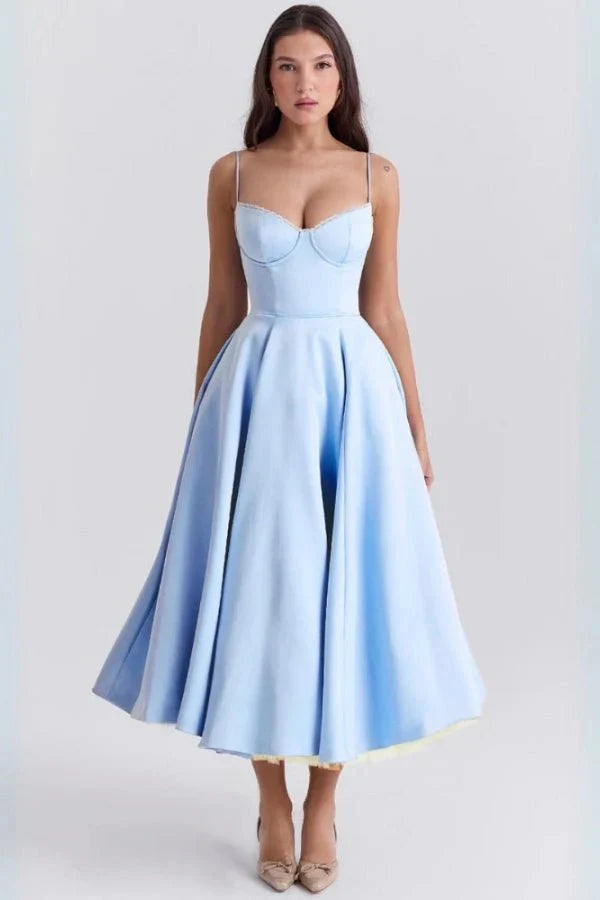 Light blue midi dress with fitted bodice and flared skirt for wedding guest