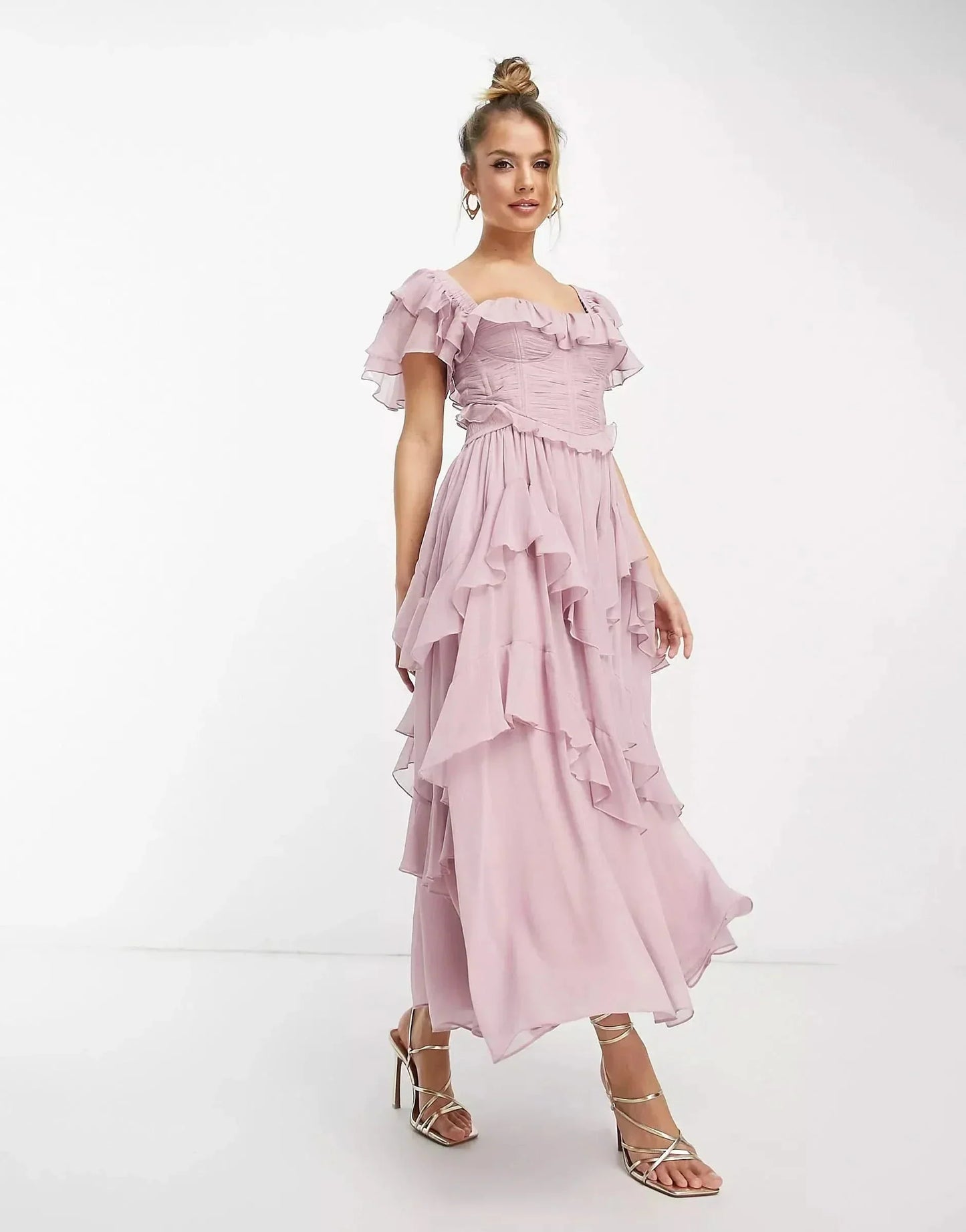 Front view of blush pink wedding guest ruffle midi dress with square neckline and tiered chiffon skirt