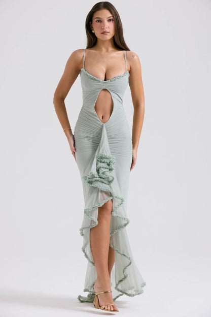 Front view of light blue sheer maxi dress with ruffle trim and deep front cutout