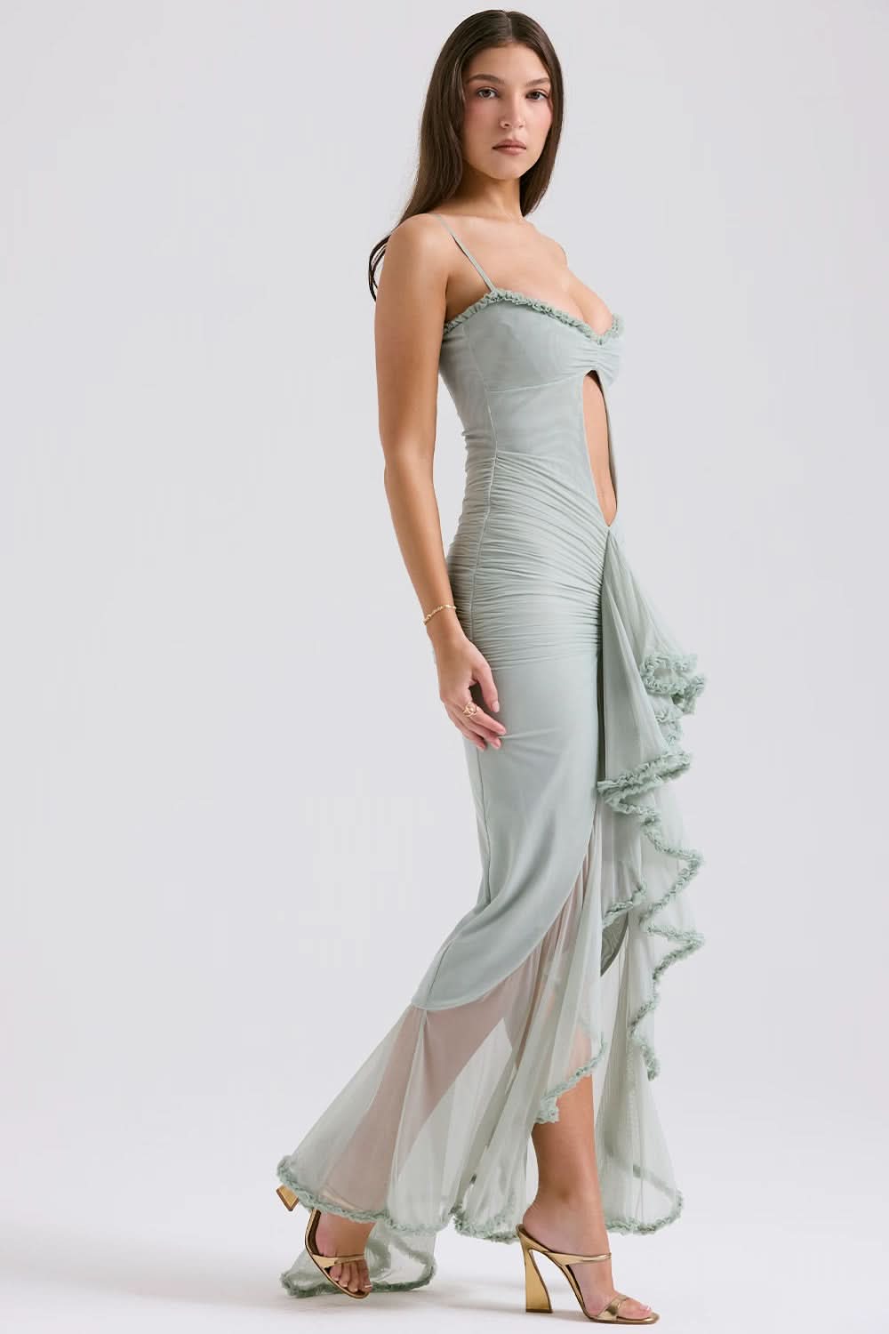 Side view of sage sheer ruffle maxi dress with straps and high slit