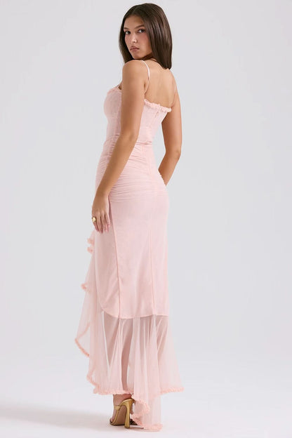 Back view of blush pink sheer ruffle maxi dress with adjustable straps and sheer hem
